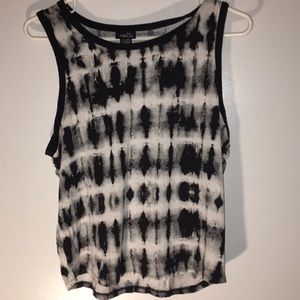 Black and white muscle shirt.